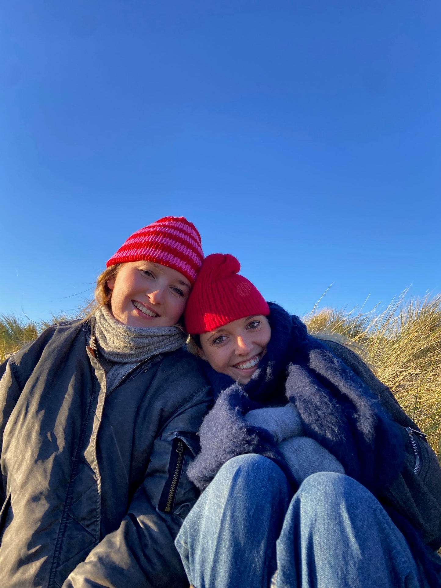 Pink and red striped knitted beanie