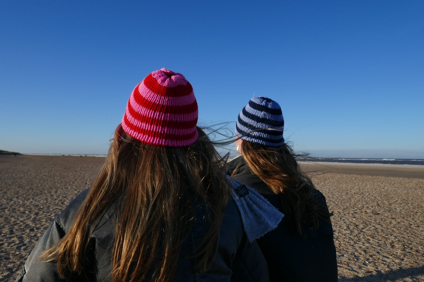 Pink and red striped knitted beanie