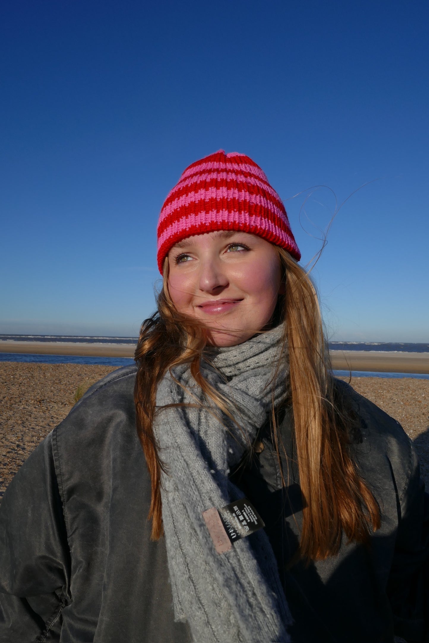 Pink and red striped knitted beanie