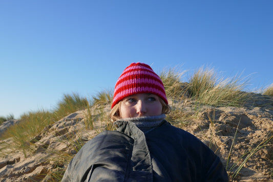 Pink and red striped knitted beanie